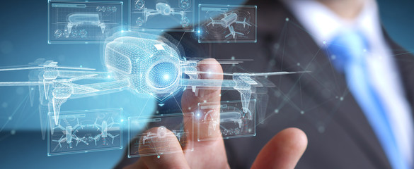Businessman holding and touching holographic drone projection in his hands 3D rendering