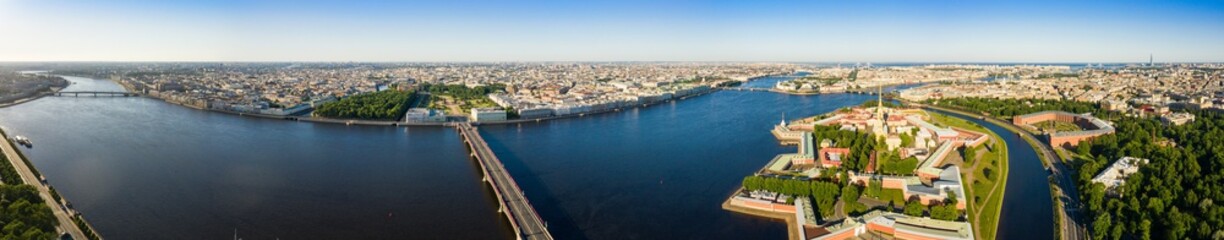 Fototapeta na wymiar Panorama of the central part of St. Petersburg Troitsky Bridge and Aerial view of Peter and Paul Fortress in Saint-Petersburg