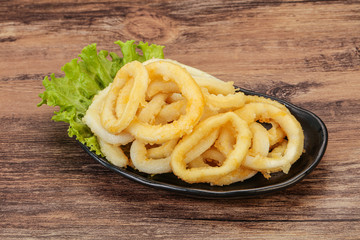 Roasted squid rings with salad