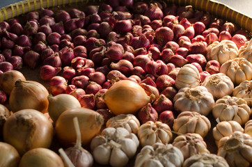 Garlic, Onion And Spices on wooden background. Selective focus.