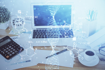 Desktop computer background and DNA drawing. Double exposure. Science concept.