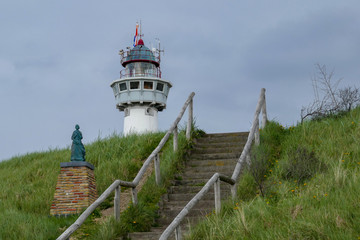 Fototapeta na wymiar historic lighthouse on the shore of the coast