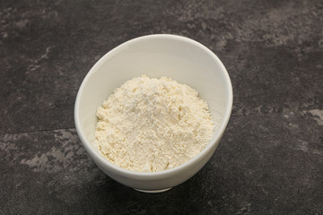 Wheat flour heap in the bowl