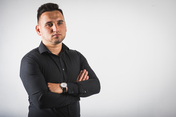 Fototapeta premium young emotional man shows hand gestures, isolated on a white background there is a place for the inscription text 