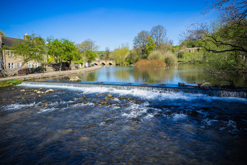 The River Wye at Bakewell with ancient Bakewell bridge upstream