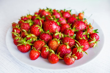 Plate filled with fresh strawberries