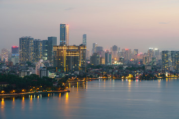 Fototapeta premium Hanoi cityscape with skyline view during sunset period at West Lake ( Ho Tay ) in 2020