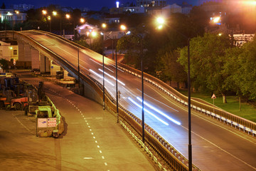 Fototapeta premium view of the industrial port in the evening - the road and railway for deliver goods to the ships for transportation by sea
