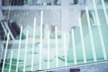 Forex Chart hologram on table with computer background. Multi exposure. Concept of financial markets.