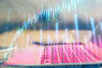 Stock market graph and table with computer background. Multi exposure. Concept of financial analysis.