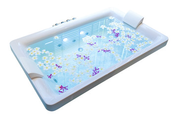 Spa bathtub decorated with flower isolated on white