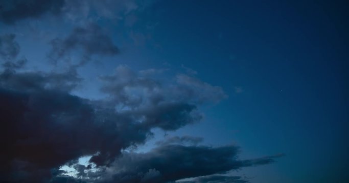Clouds moving in night sky timelapse