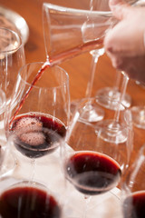 Hand pouring wine in Party