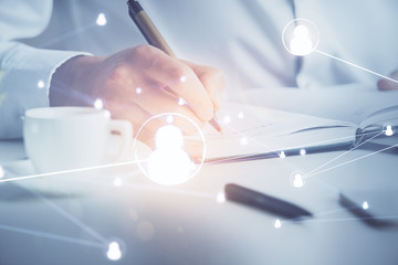 Man's hands working with notes background. Social networking scheme . Mixed media