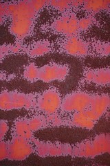 Brightly colored metal background with rust, metal background texture with bright copper red color with vintage textured design