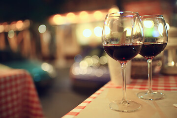 abstract aperitif alcohol glass in a restaurant interior, red wine background