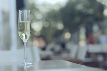 glass white wine restaurant interior, abstract evening dinner with alcohol at the bar
