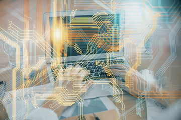 Multi exposure of world map hologram with man working on computer on background. Concept of worldwideweb.