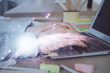 Social network theme hologram with businessman working on computer on background. Concept of world...