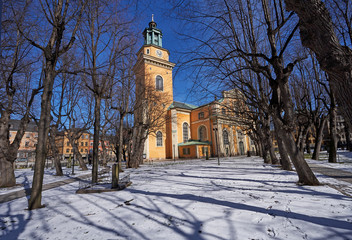 Fototapeta na wymiar Facade of the protestant Maria Magdalena Church in Stockholm in the snow