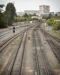 Fototapeta na wymiar Branching of railway lines, many railway lines near the station (vertical)
