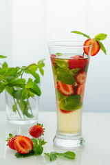 Mojito with mint and strawberries, fruit tea, strawberry mint tea.