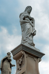 Obraz premium Old sculptures near a church of Kamyanets-Podilsky city, Ukraine