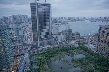 Fototapeta premium urban city skyline aerial view under cloudy sky in Tokyo, Japan