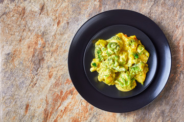 portion of Cheesy Broccoli bake on a plate