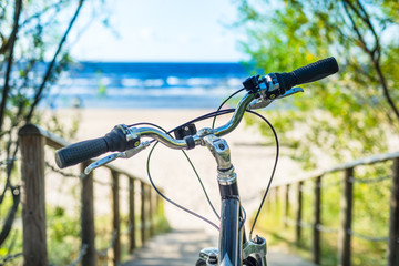 Fototapeta na wymiar Bicycle handlebar on sea beach