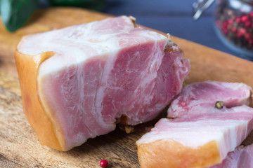 a piece of fresh bacon is on the table