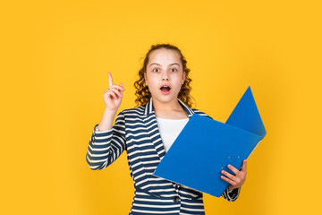 Education concept. Happy girl hold library folder. School library. Knowledge and information....