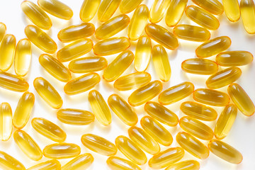 Fish oil capsules pill background. Omega 3. Concept of healthcare. Top view, flat lay