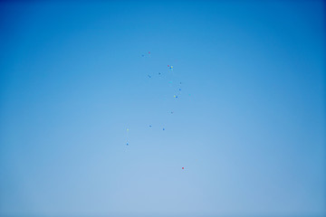 Balloons flying in the blue sky