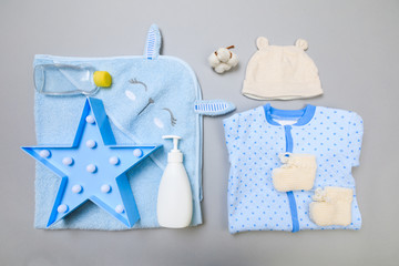 Baby concept. Baby cloth and goods on grey  background. Place for text. View from above. Flat Lay - Image