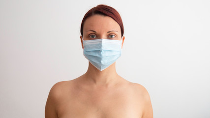 Medical mask on the face of a woman.