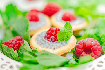 light summer dietary dessert (proper nutrition) is a tart with chia seeds, raspberries and mint. Healthy food for those who look after their figure