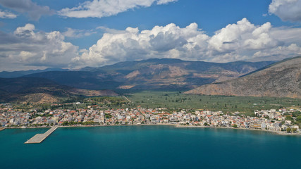 Naklejka premium Aerial drone panoramic photo of picturesque seaside town of Itea built in the slopes of mount Parnassos, Fokida, Greece