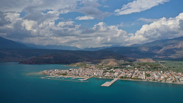Aerial drone panoramic photo of picturesque seaside town of Itea built in the slopes of mount Parnassos, Fokida, Greece © aerial-drone