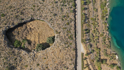 Aerial drone photo of volcanic crater formed thousand years ago by meteorite that fell near tropical exotic coast © aerial-drone