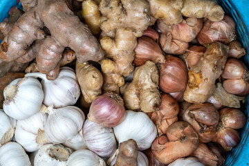 Dry garlic, onion and ginger for sale at street food market in the old town of Hanoi, Vietnam