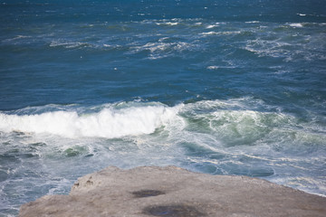 Foamy stong waves crashing in the ocean