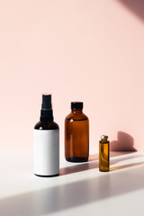 Vertical photos with three bottles, containers for perfume, lotions, and other liquids.