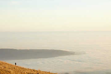Lonely man walking over the top and panorama