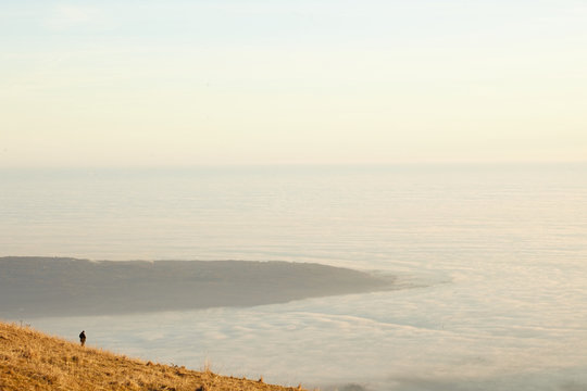 Lonely man walking over the top and panorama