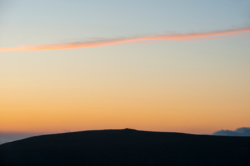 Majestic landscape image at sunset over Dartmoor National Park in Engand with beautiful soft pastel colors