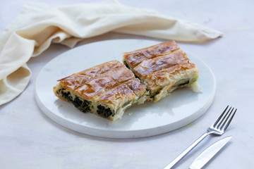 spinach pie on a white background