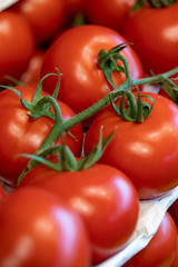 Organic tomatoes ready for sale at the greengrocer stall