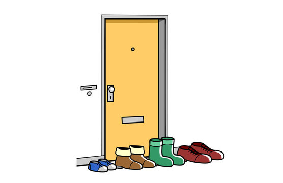 Viele Schuhe von Familie vor T&uuml;r im Hausflur oder Treppenhaus