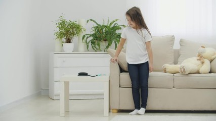 4k video of little girl in the morning brushing her long hair.